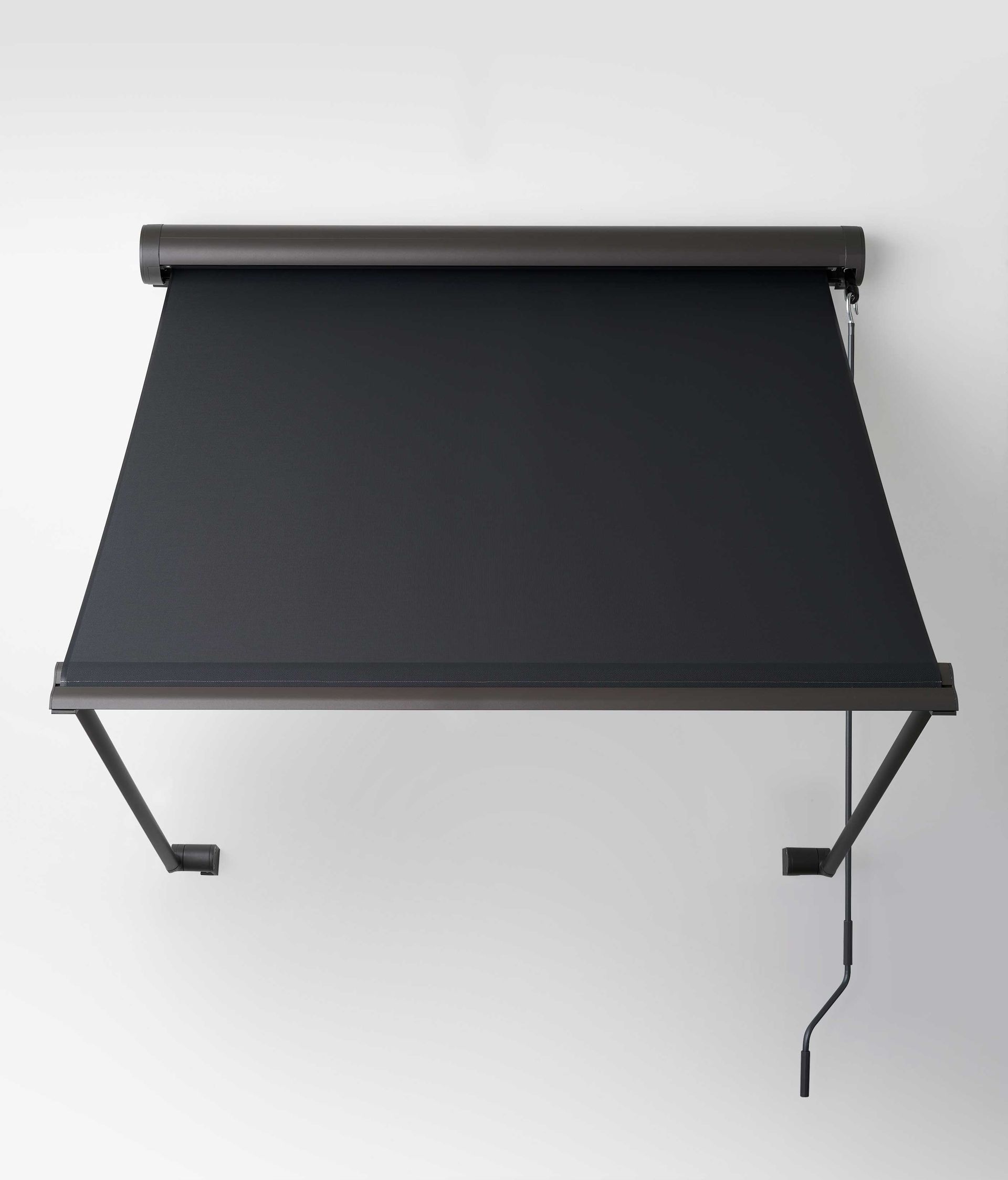 A black and white striped awning is hanging on a wall.