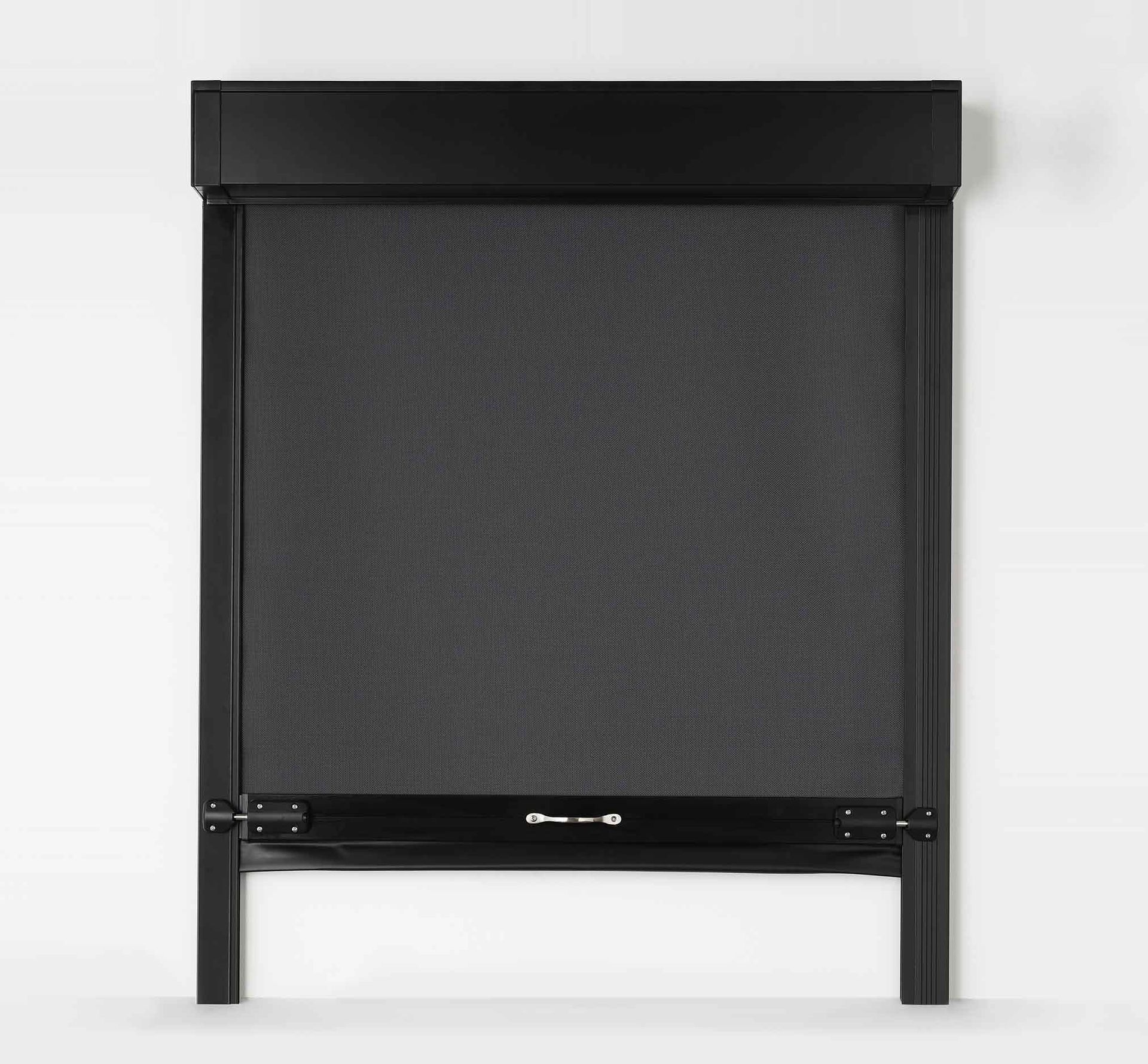 A plant is sitting in front of a window with blinds.