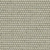 The sun is shining through a metal fence