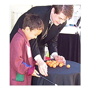 Face Painting — Magician Teaching Kid with Face Paint in Goodrich, MI