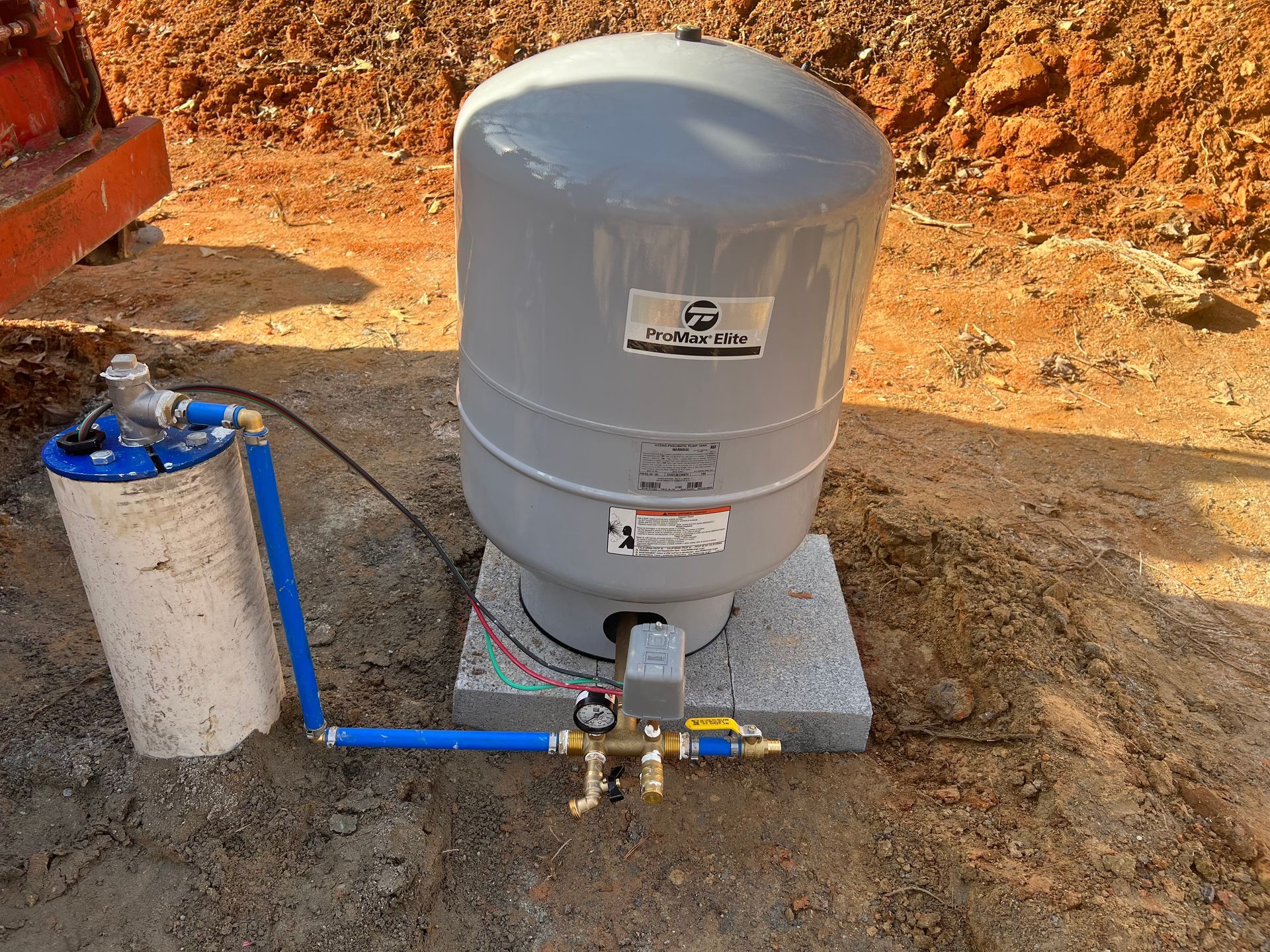 A water tank with a pressure gauge attached to it