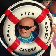 Boy with sunglasses smiles through life preserver; reads 