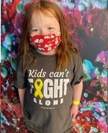 Girl wearing a mask and shirt that says 