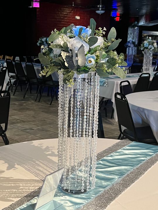 A vase filled with flowers is sitting on top of a table.