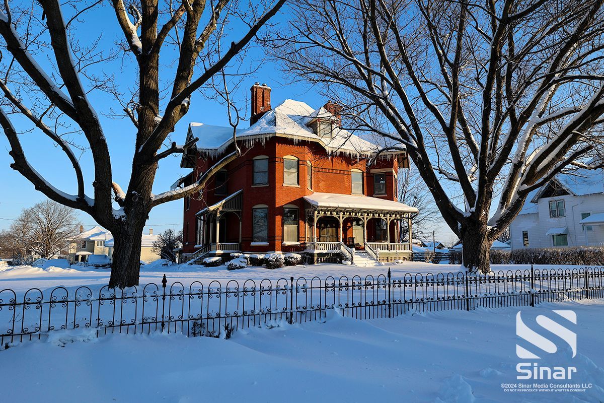 Snow-covered Victorian-style manor in Maquoketa, Iowa. 