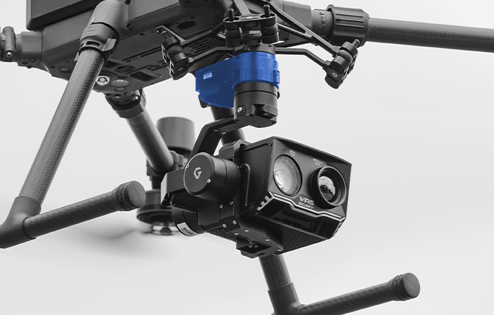 A close up of a drone with a camera attached to it.