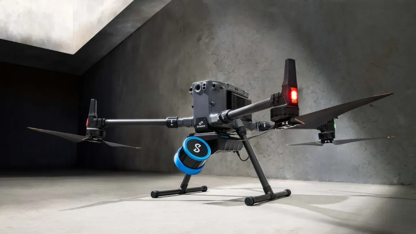 A drone is sitting on the ground in a room.