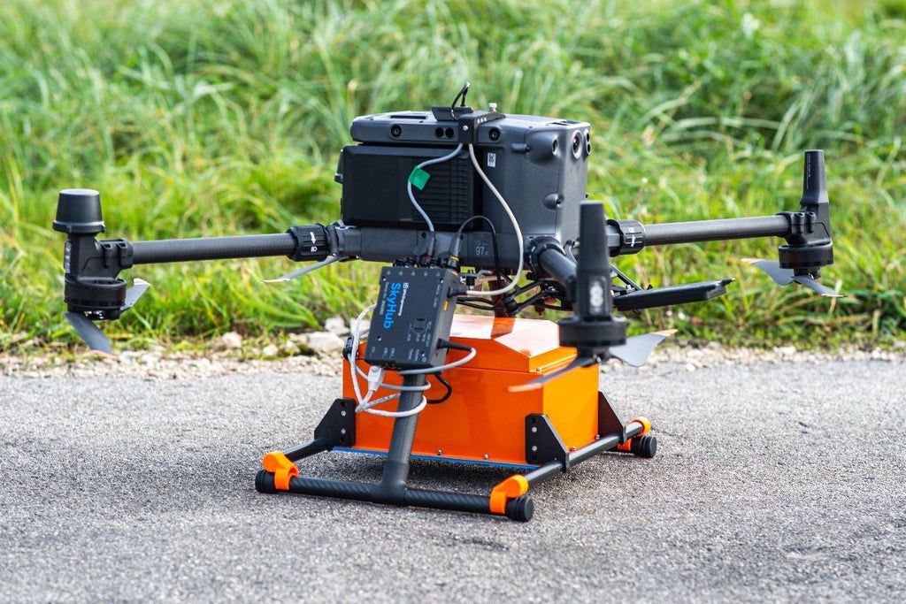 A camera is sitting on top of a gimbal in the rain.