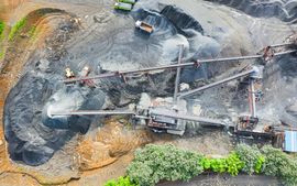 An aerial view of a coal mine with a lot of machinery.