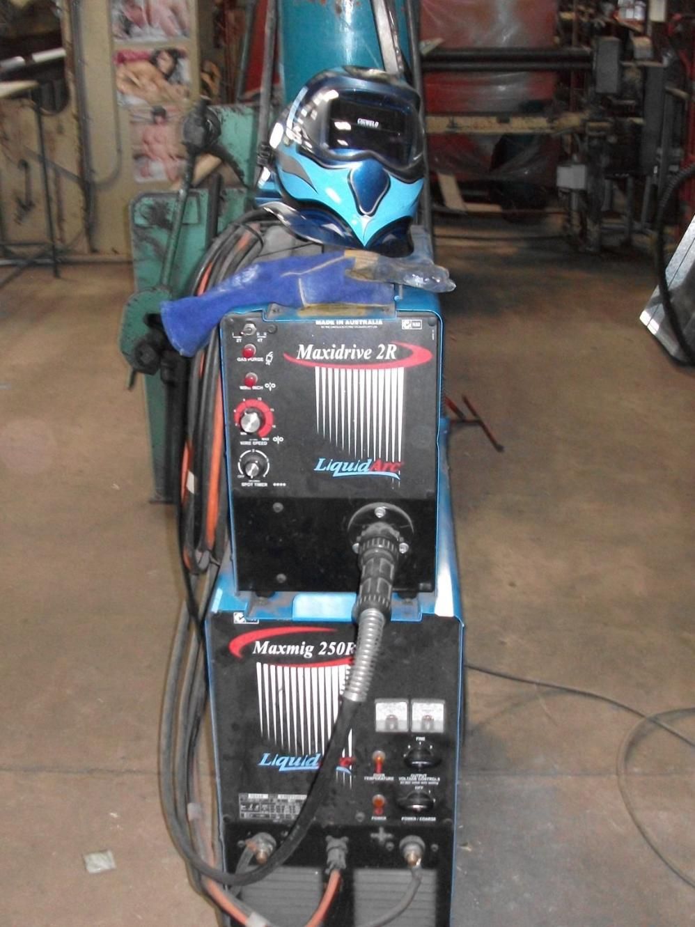 A Welding Machine With a Helmet on Top of It — HTH Sheetmetal Mackay in Mackay, QLD