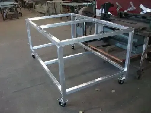 A Metal Frame With Wheels is Sitting on the Floor in a Room — HTH Sheetmetal Mackay in Mackay, QLD