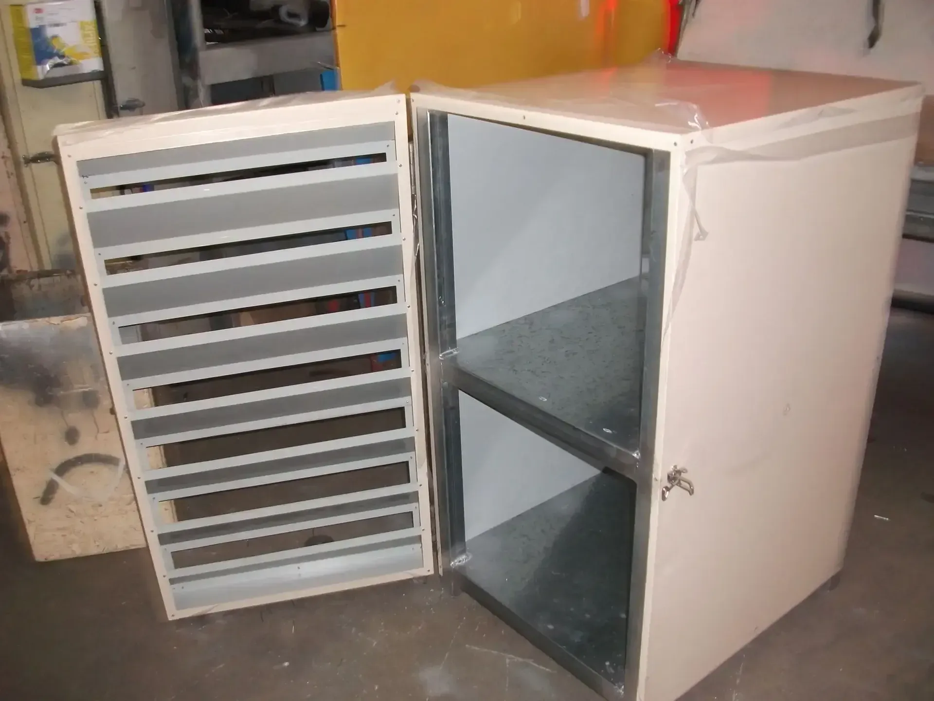 A White Cabinet With the Door Open is Sitting on a Table — HTH Sheetmetal Mackay in Mackay, QLD
