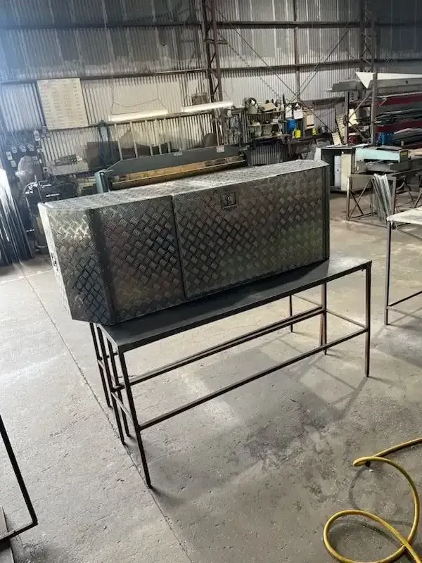 A Large Metal Box is Sitting on Top of a Metal Table in a Warehouse — HTH Sheetmetal Mackay in Mackay, QLD