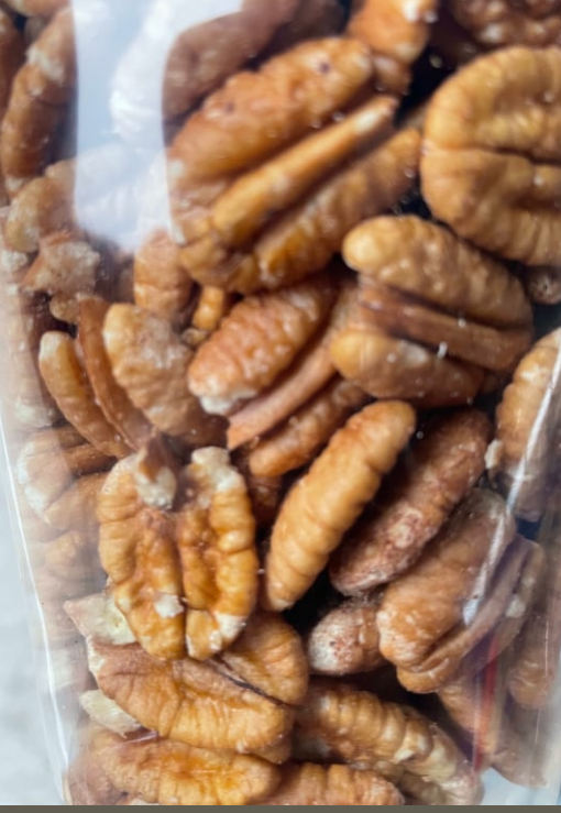 A bag of pecans is sitting on a table.