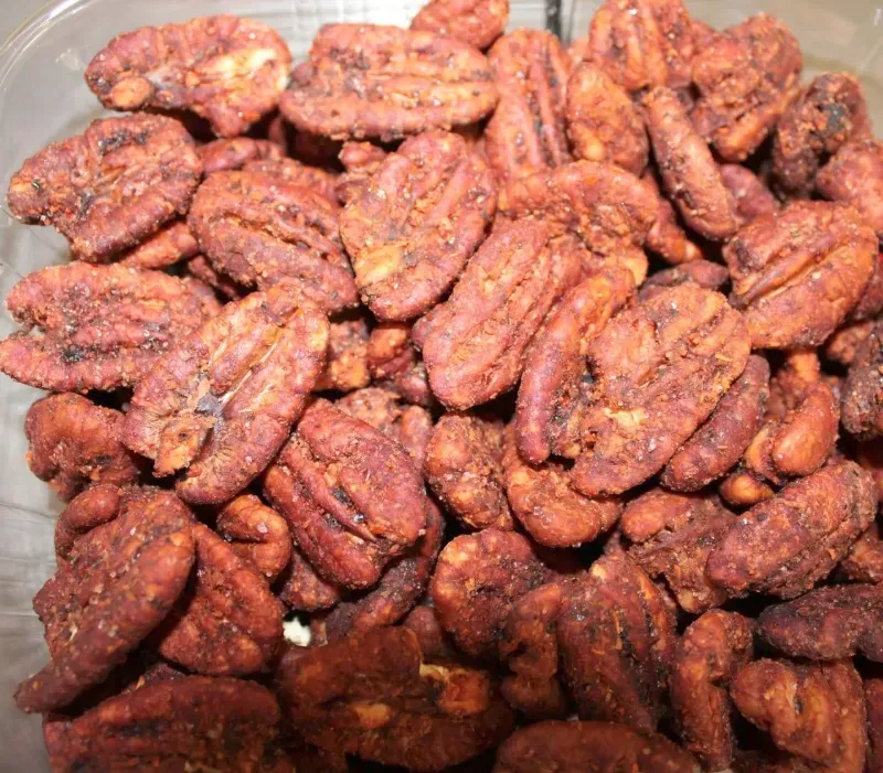Close-up of Tajín flavored pecans - spicy candied pecans with a tangy, crunchy Texas flavor.