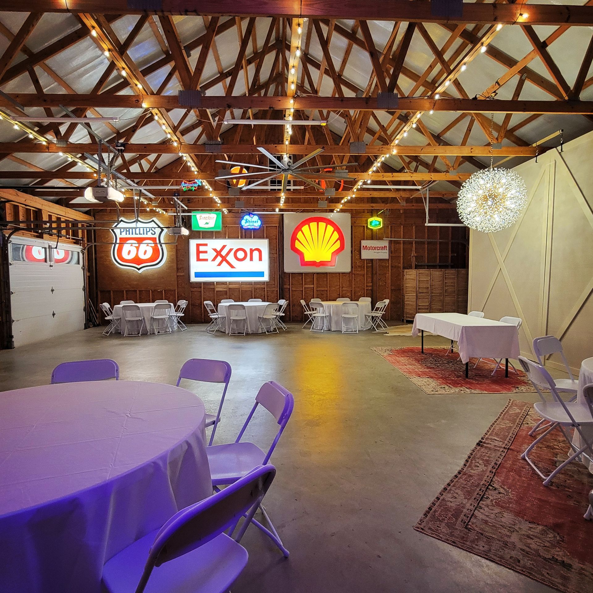 A room with tables and chairs and a sign that says exxon