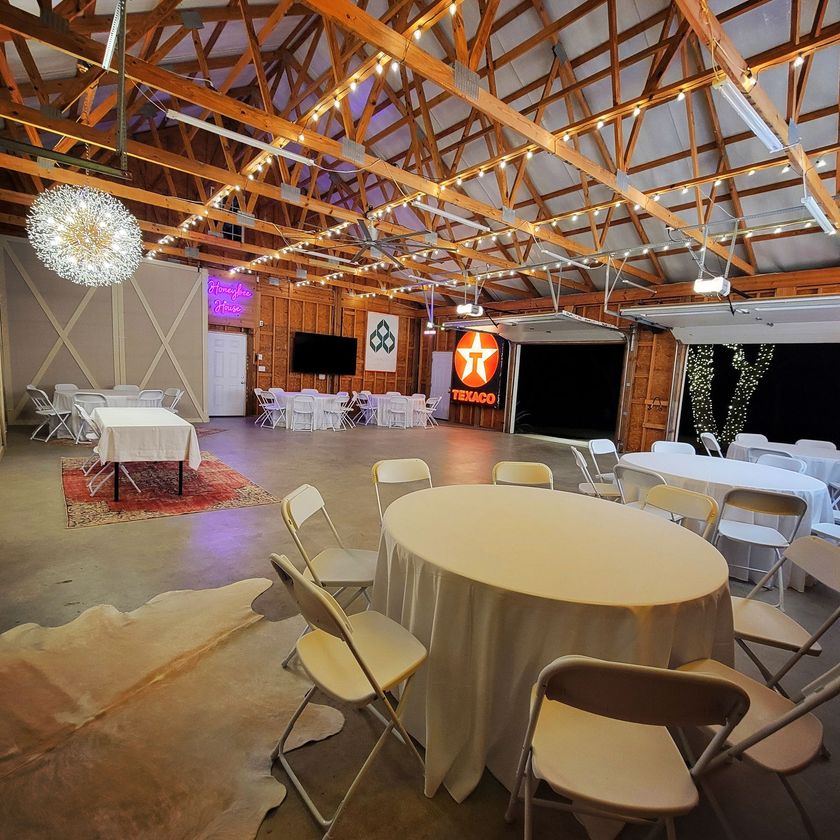 A large room with tables and chairs and a sign that says texaco