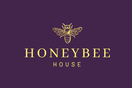 A honeybee house logo on a purple background