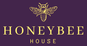 A honeybee house logo on a purple background