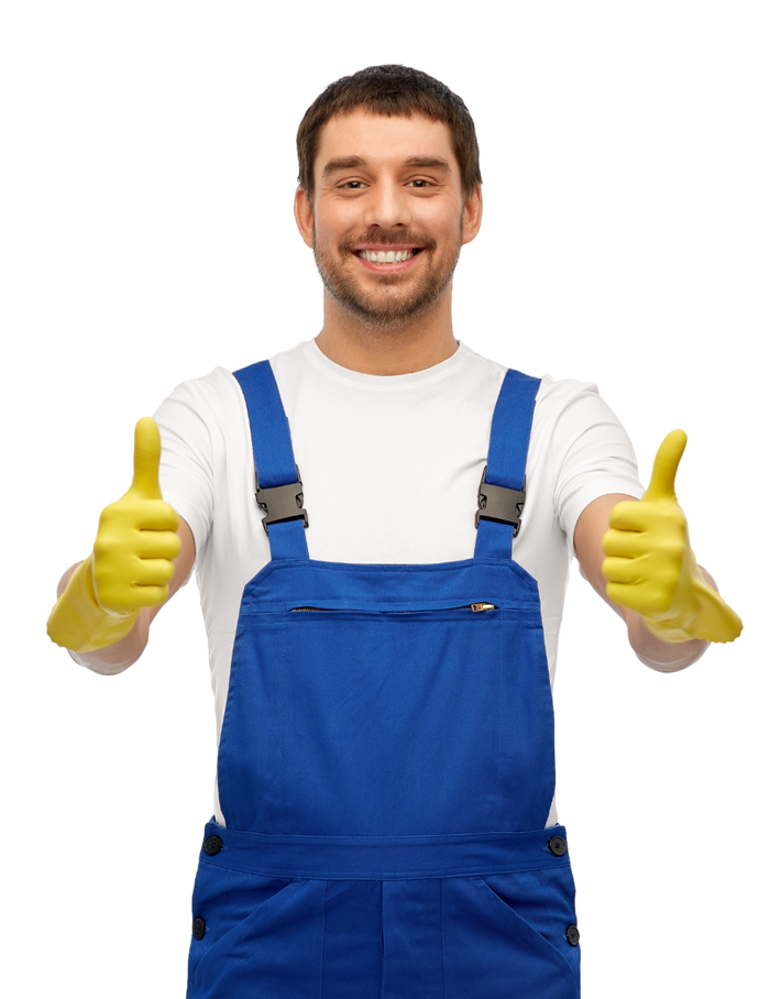 A man wearing blue overalls and yellow gloves is giving two thumbs up.