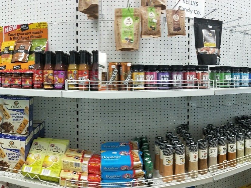A grocery store shelf filled with spices and condiments-Butcher in Darwin