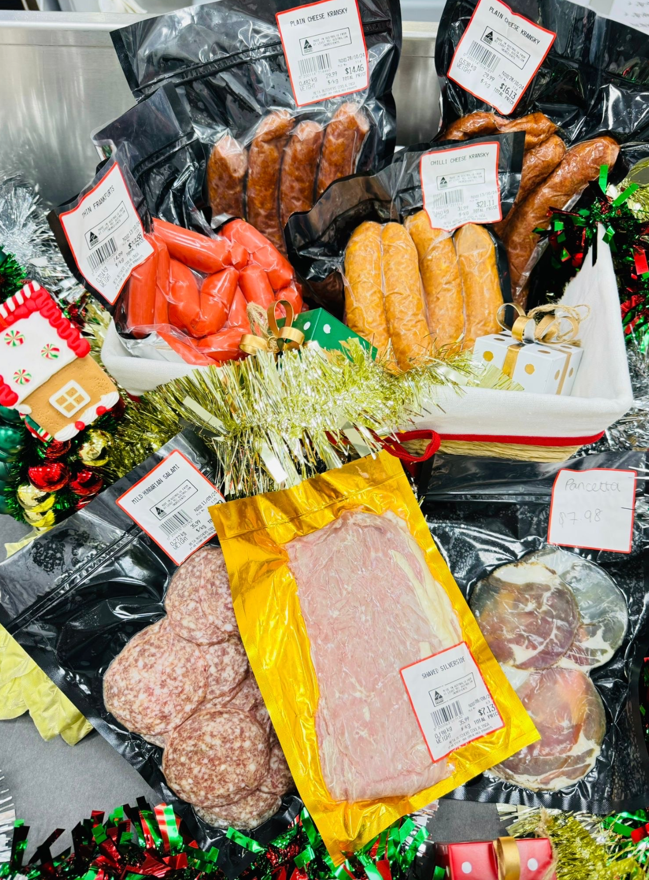 A variety of meats and sausages are sitting on a table-Butcher in Darwin