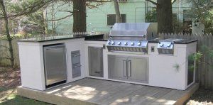 A well-equipped outdoor kitchen with a grill and sink, great for enjoying meals in the fresh air.