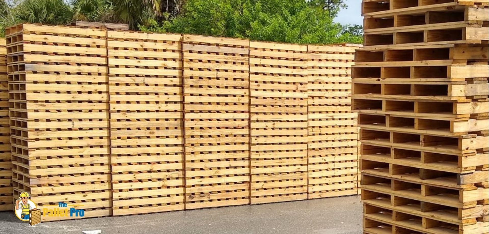 A bunch of wooden pallets are stacked on top of each other.