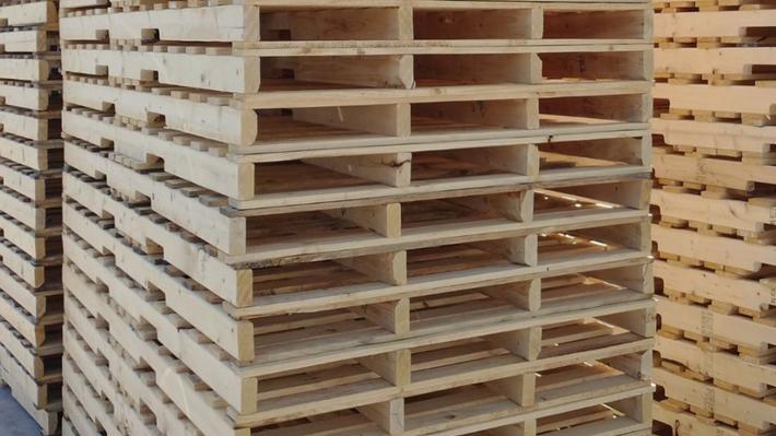A pile of wooden pallets stacked on top of each other