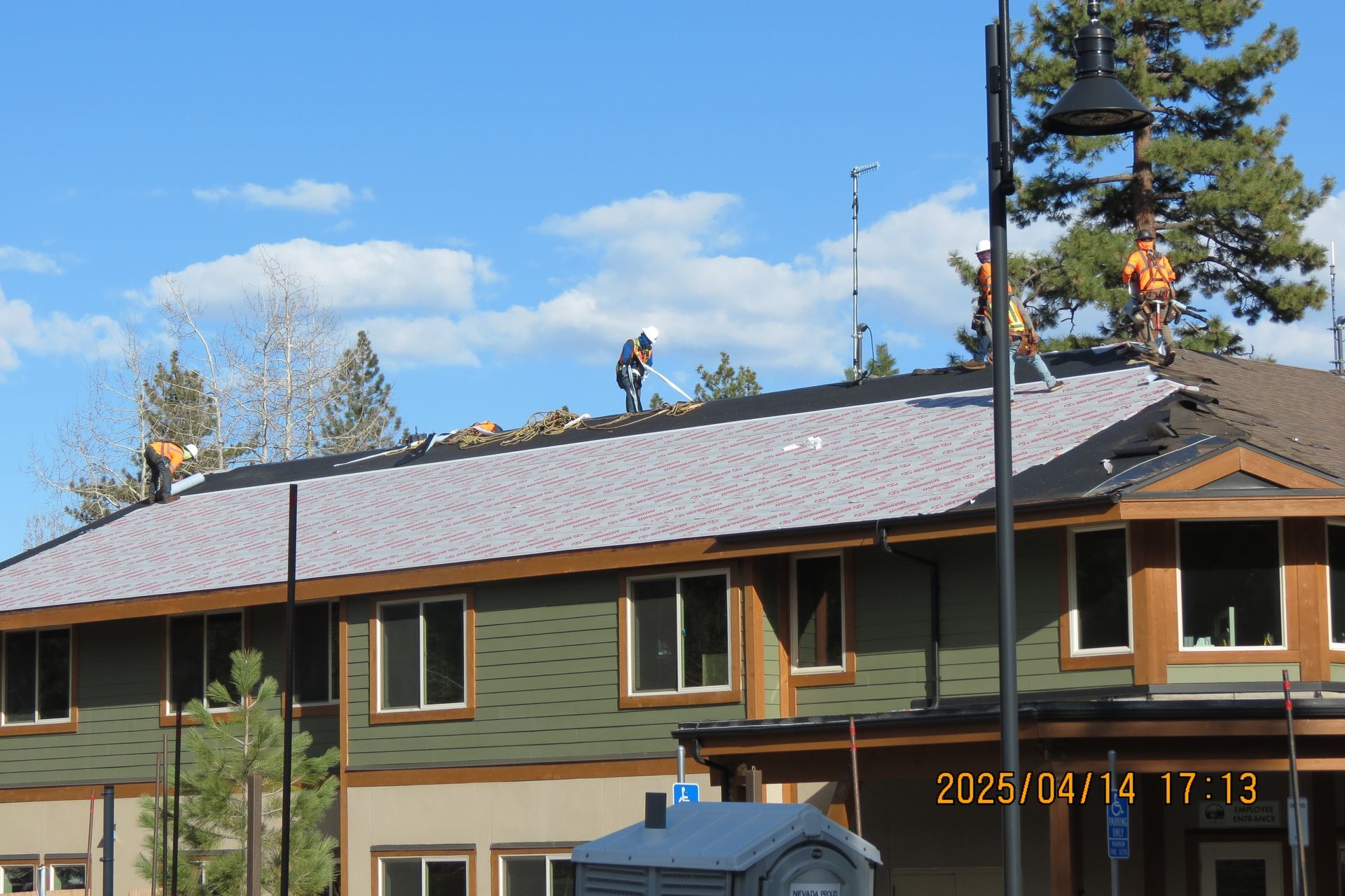 A person is painting a wall with a brush.