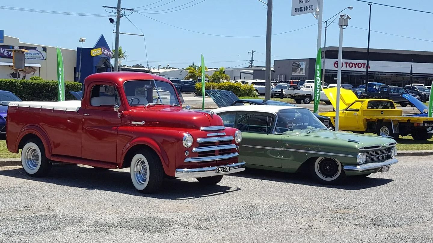 A Red Vintage Pickup Truck, A Green Classic Car — THG Tires in Gladstone Central, QLD