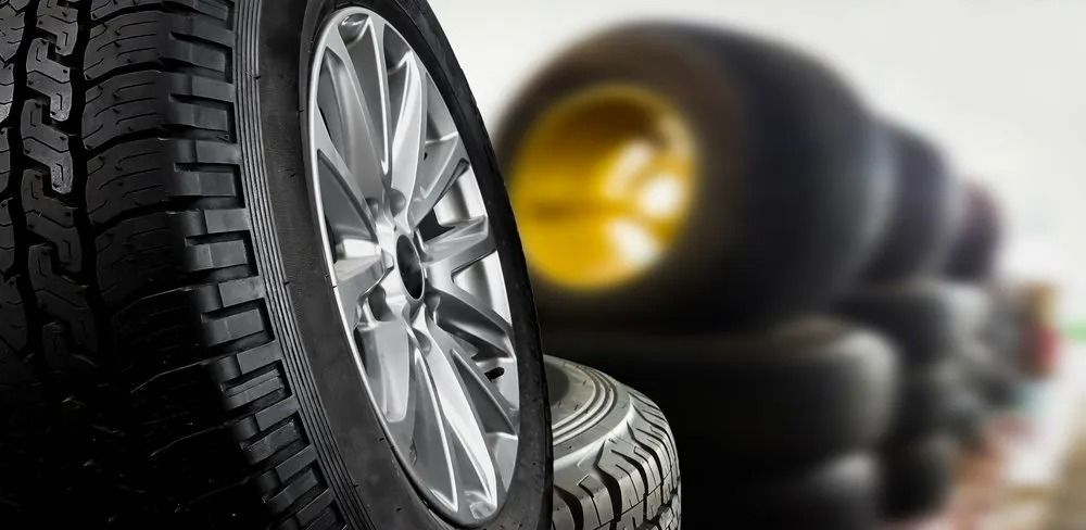 A Close-up Of A Black Tire Mounted On A Silver Rim — THG Tires in Gladstone Central, QLD