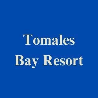 A blue background with white text that says tomales bay resort