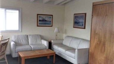 A living room with two couches and a coffee table.