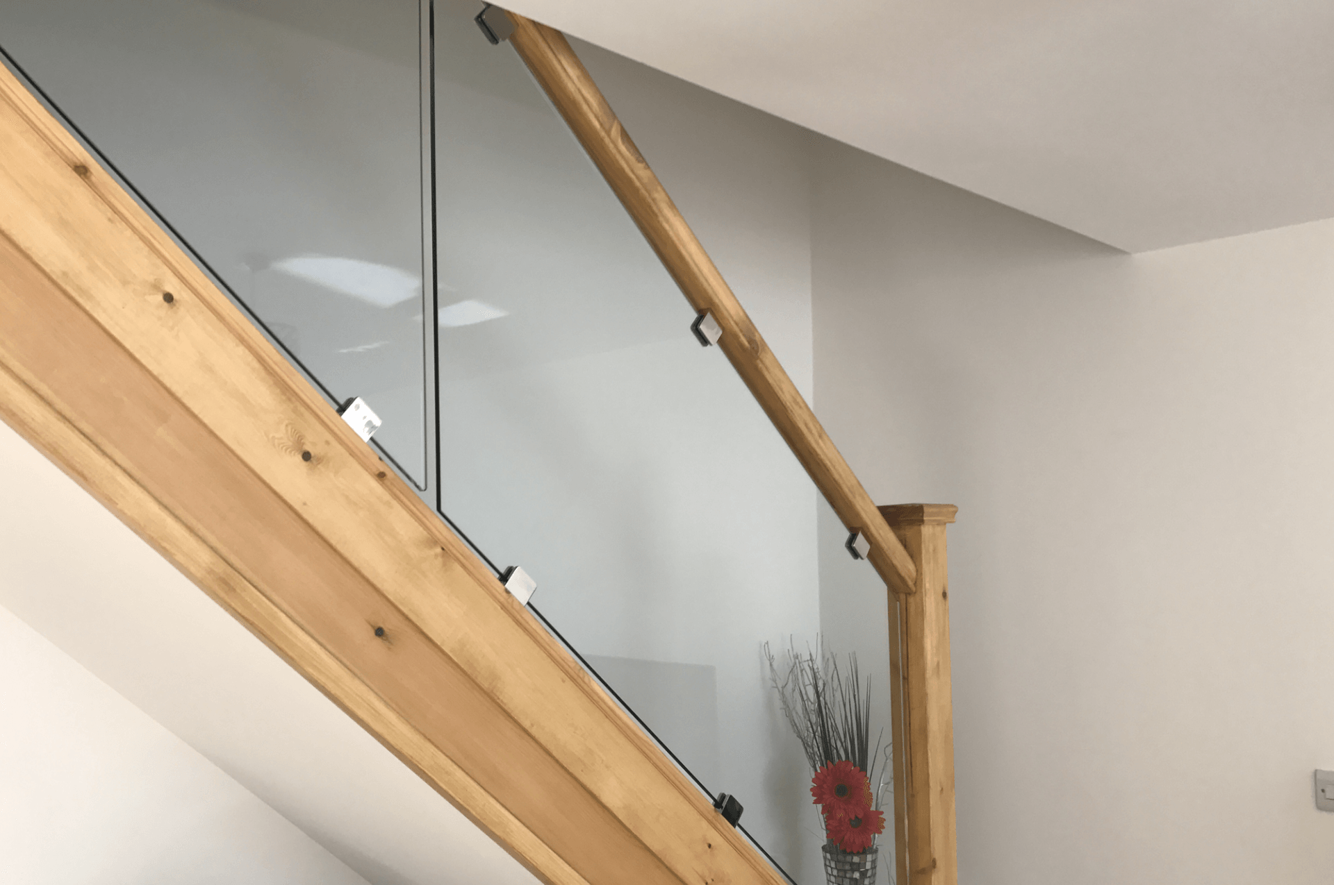 woodern staircase with glass balustrade