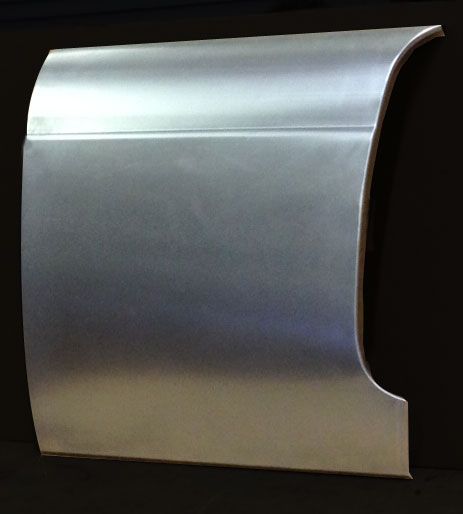 Metal car door panel, silver, with curved edges and seam line.