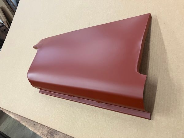 Red metal car body panel; right side, showing edge details.
