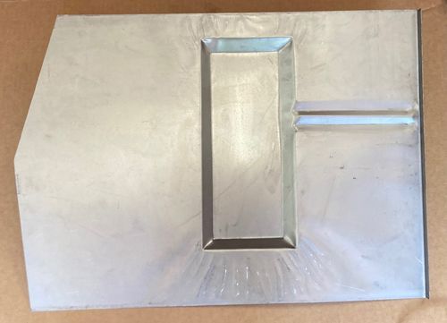 Aluminum metal plate with a rectangular inset and a horizontal ridge.