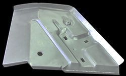 Steel floor pan for a car, with molded sections and various holes.