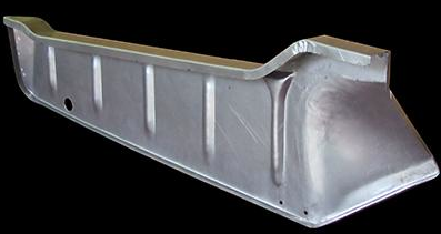 Metal automotive rocker panel, gray, with vertical support ribs and angled front.