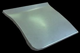 Curved metal automotive repair panel, angled against a black background.