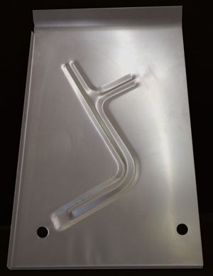 58-60 thunderbird  rearfloor pan with three raised, angled slot-shaped stampings The pan has a bent top edge and two holes.