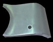 Metal car body panel with a hole.