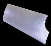 Silver metal car body panel with curved edges.