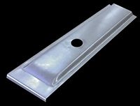 Metal car body panel with a central hole, a raised central section, and angled edges.
