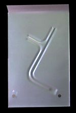 58-60 thunderbird  rear floor pan with three raised, angled slot-shaped stampings The pan has a bent top edge and two holes.