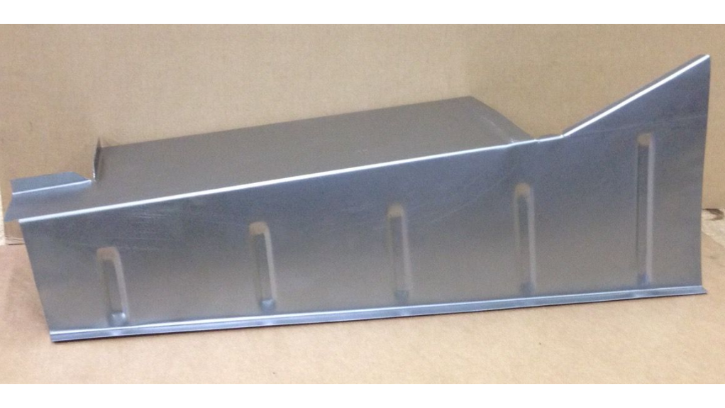 Metal piece with angular design and vertical slots.