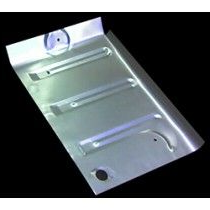 Metal car floor panel with ridges and holes.