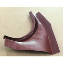 Maroon-colored metal car body panel, curved with angular sides, resting on a beige surface.