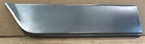 Metal car panel, gray with a curved corner and a folded bottom edge.